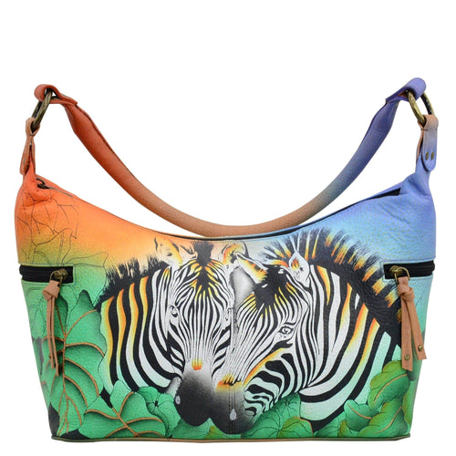 Anna by Anuschka style 8320, handpainted Medium East West Hobo. Zebra Safari painting in multi color. Featuring inside zippered wall pocket, two multipurpose pockets and two zippered side pockets.