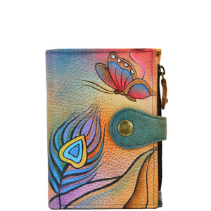 Anna by Anuschka style 1700, handpainted Ladies Wallet. Peacock Butterfly painting in Multi color. Featuring full length bill pockets, eight credit card pockets, four multi purpose pockets and zippered coin pocket.
