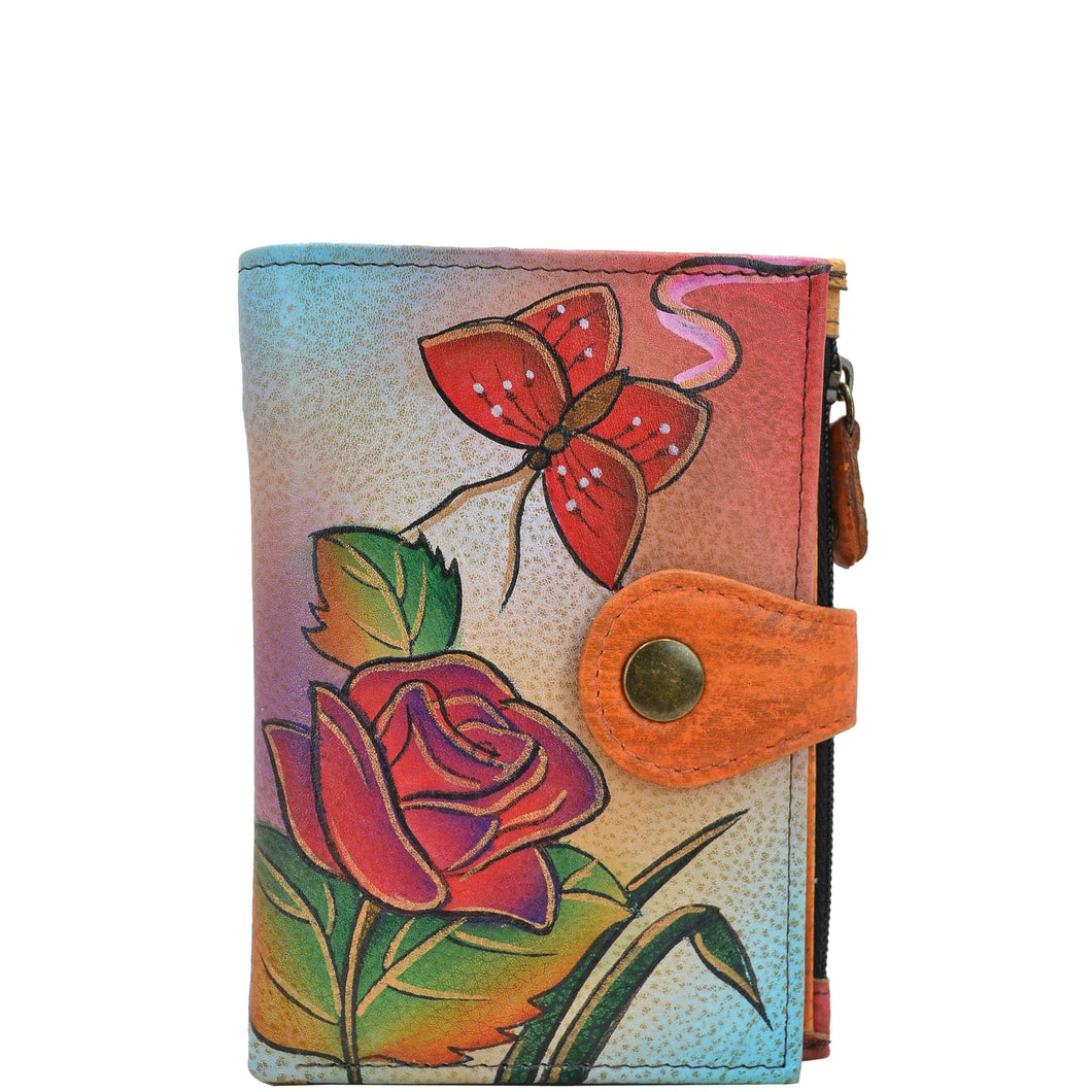 Anna by Anuschka style 1700, handpainted Ladies Wallet. Rose Butterfly painting in Brown color. Featuring full length bill pockets, eight credit card pockets, four multi purpose pockets and zippered coin pocket.