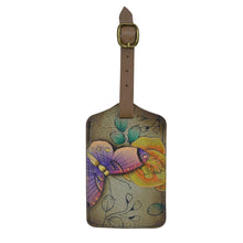 Load image into Gallery viewer, Anna by Anuschka style 1805, handpainted Luggage Tag. Floral Paradise Tan painting in Tan color. Featuring adjustable strap with buckle and one ID pocket.
