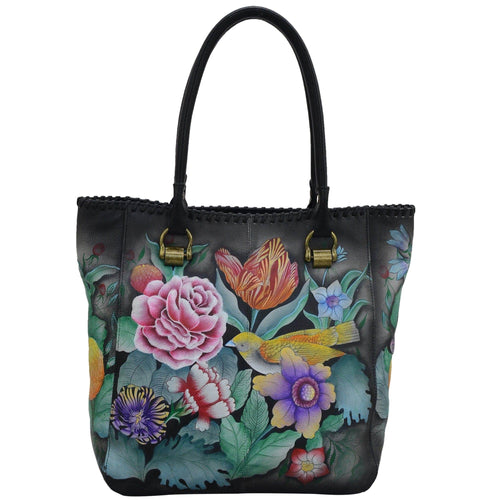 Anuschka style 609, handpainted Tall Tote With Double Handle. Vintage Bouquet Painted in Black Color. Featuring one open wall pocket, and two multipurpose pockets with removable fabric cosmetic pouch and optical case.