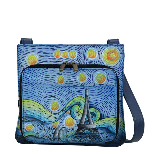 Anna by Anuschka style 7011, handpainted Slim Shoulder Organizer. Love In Paris painting in blue color. Featuring front all round zip entry to organizer with multi purpose pockets, credit card holders & ID window, adjustable handle drop, Built-in organizer, Fits E-Reader, Fits tablet.