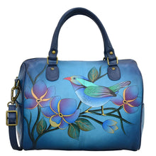 Load image into Gallery viewer, Anna by Anuschka style 8067, handpainted Large Zip Around Satchel. Lonesome Bird Denim painting in blue color. Featuring inside zippered wall pocket, cell and multi purpose pocket, Removable strap, Fits Laptop.
