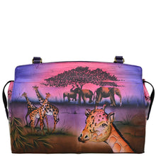 Load image into Gallery viewer, Anna by Anuschka style 8077, handpainted Large Satchel. Serengeti Sunset painting in pink/peach color. Featuring inside one full length pocket, one zippered wall pocket, one cell pocket and two multipurpose pockets, Fits Laptop.
