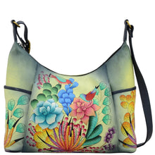 Load image into Gallery viewer, Anna by Anuschka style 8082, handpainted Large Shoulder Hobo. Succulent Dreams painting in grey color. Featuring two open side pockets, Fits Laptop, Fits tablet.
