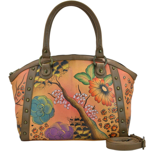 Anna by Anuschka style 8176, handpainted Large Studded Satchel. Floral Safari Brown painting in brown color. Featuring inside full length zippered pocket, two multipurpose pockets, Fits Laptop.