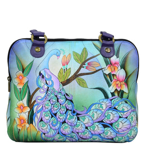 Anna by Anuschka style 8180, handpainted Triple Compartment Organizer. Midnight Peacock painting in blue color. Featuring three full length top zippered compartment, Built-in organizer, Fits E-Reader, Fits tablet.