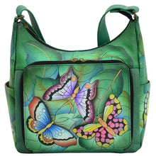 Load image into Gallery viewer, Anna by Anuschka style 8209, handpainted Organizer Hobo. Summer Wings painting in green/mint color. Featuring front all round zippered organizer pocket with five credit card holders, one ID window, two penholders, open pocket, Fits tablet, Fits E-Reader, Built-in organizer.
