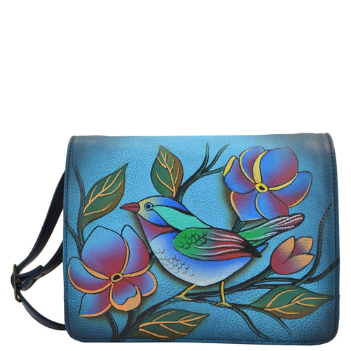 Anna by Anuschka style 8218, handpainted Small Flap Crossbody Organizer. Lonesome Bird Denim painting in blue color. Featuring one zippered and two open compartments, Built-in organizer, Fits E-Reader.