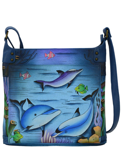 Anna by Anuschka style 8253, handpainted Cross Body Organizer. Playful Dolphin painting in blue color. Featuring inside one full length zippered wall pocket, open wall pocket, two multipurpose pockets, 4 credit card pockets, One Slip in pocket, two pen holders, built-in organizer.