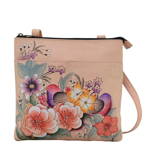Anna by Anuschka style 8272, handpainted Multi Compartment Crossbody. Vintage Garden painting in pink/peach color. Featuring one id window and pen holders, one full length zippered pocket,two multipurpose pocket.