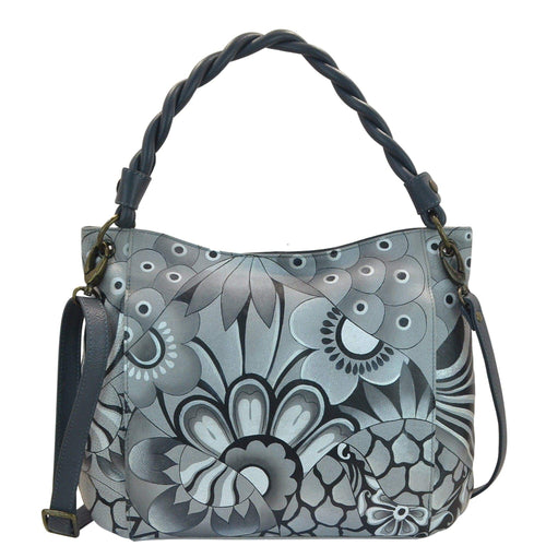 Anna by Anuschka style 8274, handpainted Slim Shoulder Bag. Patchwork Pewter painting in grey color. Featuring inside one full length zippered wall pocket, one open wall pocket, two multipurpose pockets and two vertical zippered pockets.