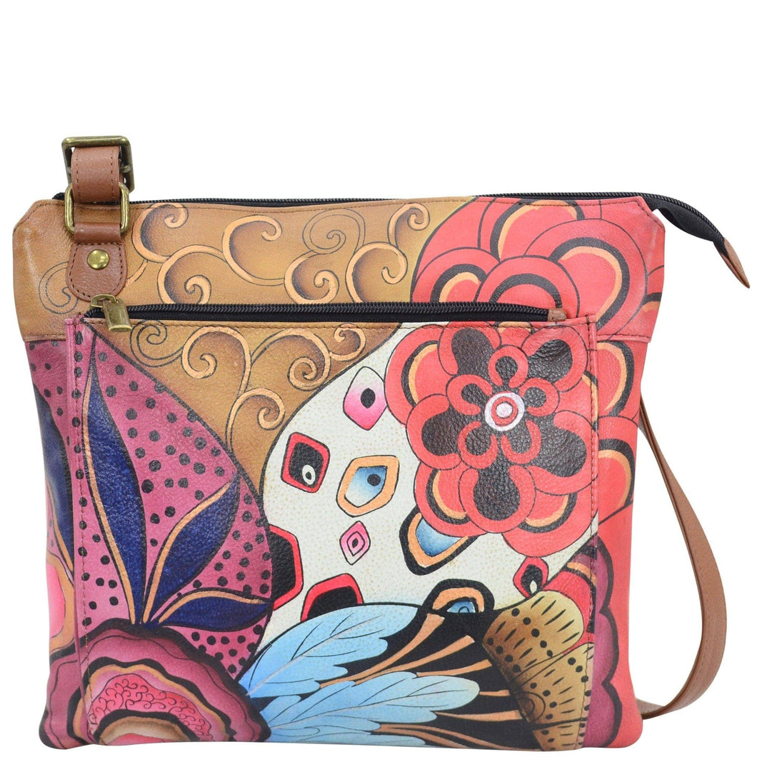Anna by Anuschka style 8285, handpainted Multi Pocket Crossbody. Tribal Potpourri painting in brown color. Inside zippered wall pocket, open wall pocket, two multipurpose pockets, Fits E-Reader, Fits tablet.