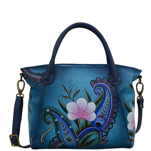 Anna by Anuschka style 8293, handpainted Slouch Tote. Denim Paisley Floral painting in blue color. Featuring fop zip entry to main compartment Inside one zippered wall pocket, Fits E-Reader, Fits tablet.