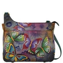 Load image into Gallery viewer, Anna by Anuschka style 8297, handpainted Medium Crossbody. Butterfly Paradise painting in grey color. Featuring two full length slip in pocket in front, Fits E-Reader, Fits tablet, Hands-free.
