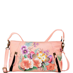 Anna by Anuschka style 8306, handpainted Wide Crossbody Satchel. Vintage Garden painting in pink/peach color. Featuring inside zippered wall pocket, two multipurpose pockets, Removable strap, Fits tablet.