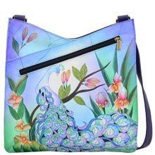 Load image into Gallery viewer, Anna by Anuschka style 8312, handpainted V Top Large Crossbody. Midnight Peacock painting in blue color. Featuring magnetic snap button entry to main compartment, Fits E-Reader, Fits tablet, Fits Laptop.
