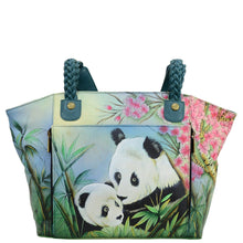 Load image into Gallery viewer, Anna by Anuschka style 8315, handpainted East-West Organizer Tote. Lovable Pandas painting in multi color. Featuring front zippered organizer chamber with eight cc holder, Built-in organizer, Fits Laptop, Fits tablet, Fits E-Reader.
