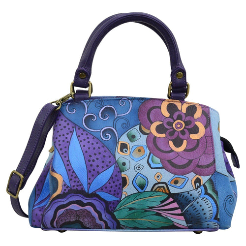 Anna by Anuschka style 8325, handpainted Small Multi Compartment Satchel. Tribal Potpourri Eggplant painting in purple color. Featuring One zippered central compartment and two open compartment, inside one full length zippered wall pocket two multipurpose pockets and rear full length zippered pocket.