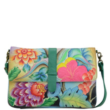 Load image into Gallery viewer, Anna by Anuschka style 8329, handpainted Medium Flap Messenger. Whimsical Garden painting in green/mint color. Featuring Front full length slip in pocket with magnetic snap button, inside full length zippered wall pocket and two multipurpose pockets.
