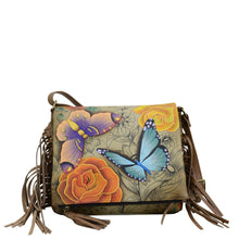 Load image into Gallery viewer, Anna by Anuschka style 8335, handpainted Fringed Flap Crossbody. Floral Paradise Tan painting in tan color. Featuring inside zippered wall pocket, two multipurpose pockets and rear full length zippered pocket, slip in cell pocket.
