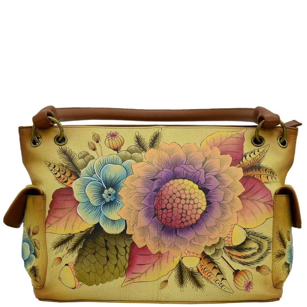 Anna by Anuschka style 8336, handpainted East West Shoulder Bag. Rustic Bouquet painting in tan color. Faeturing inside one zippered wall pocket, two multipurpose pockets and two side pockets with magnetic flap.