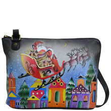 Load image into Gallery viewer, Anna by Anuschka style 8338, handpainted Two-Sided Zip Travel Organizer. Riding With Santa painting in black color. Featuring inside zippered partition pocket, zippered wall pocket, open pocket and two multi-purpose pocket, ten credit card holder.
