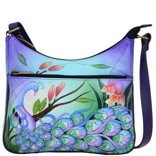 Anna by Anuschka style 8350, handpainted Medium Crossbody Hobo. Midnight Peacock painting in blue color. Featuring inside zippered wall pocket, two multipurpose pockets and front zippered pocket.
