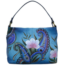 Load image into Gallery viewer, Anna by Anuschka style 8351, handpainted Large Shoulder Hobo. Denim Paisley Floral painting in blue color. Featuring inside one zippered wall pocket, one open pocket, two multipurpose pockets and one vertical zippered side pocket.
