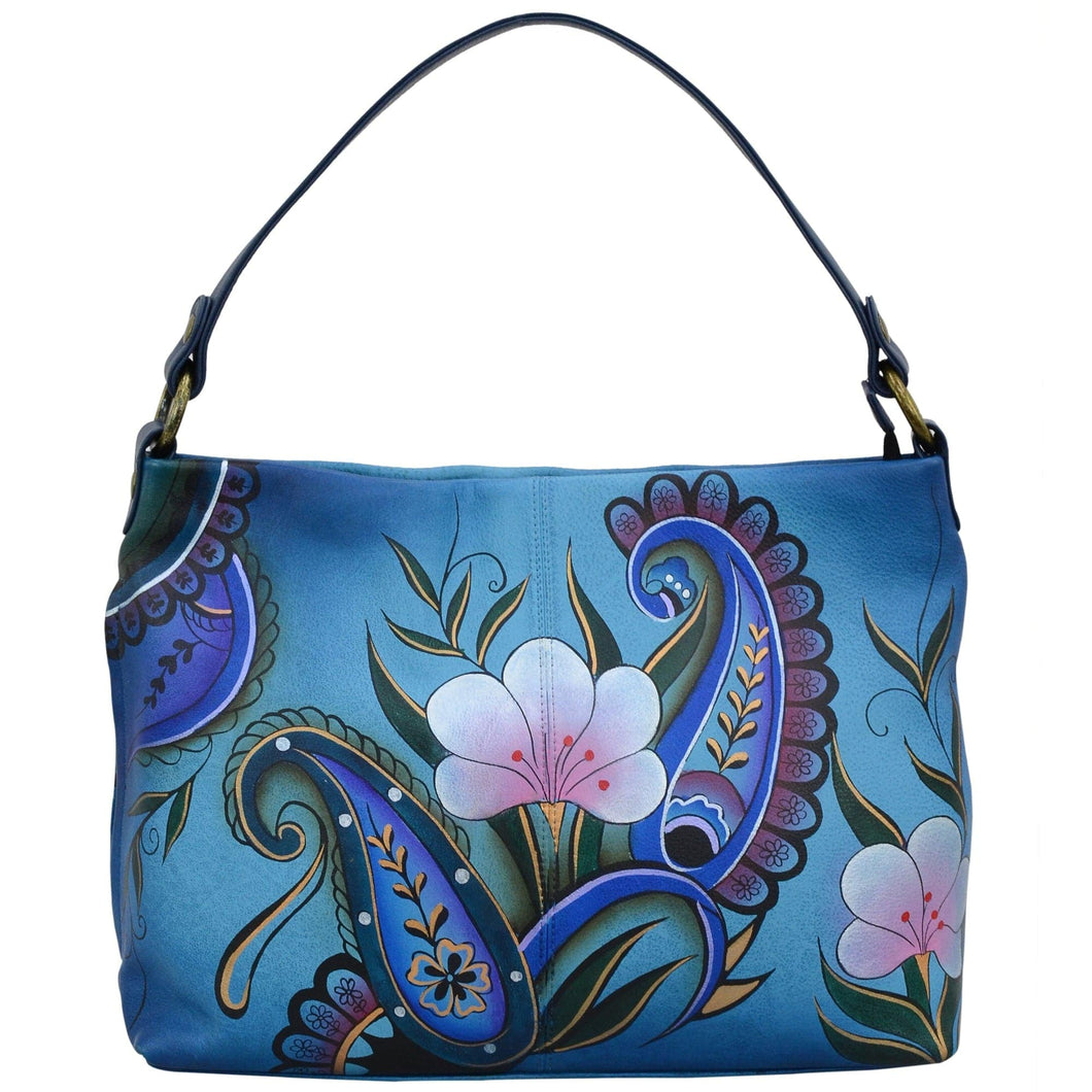 Anna by Anuschka style 8351, handpainted Large Shoulder Hobo. Denim Paisley Floral painting in blue color. Featuring inside one zippered wall pocket, one open pocket, two multipurpose pockets and one vertical zippered side pocket.