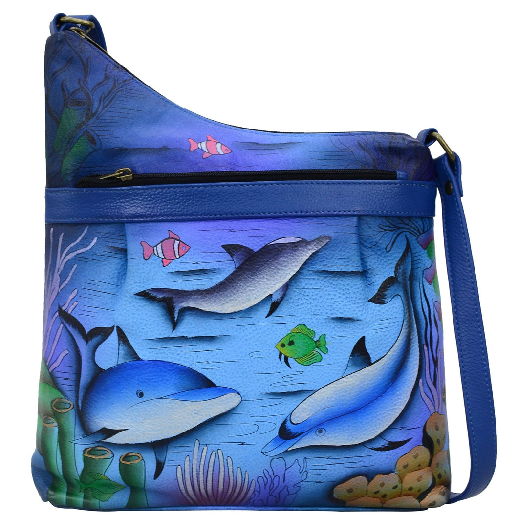 Anna by Anuschka style 8354, handpainted Assymetric Crossbody. Playful Dolphin painting in blue color. Featuring inside one zippered wall pocket, one open pocket, two multipurpose pockets and front zippered pocket.