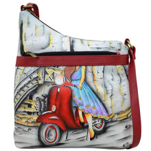 Load image into Gallery viewer, Anna by Anuschka style 8354, handpainted Assymetric Crossbody. Roman Dreams painting in white color. Featuring inside one zippered wall pocket, one open pocket, two multipurpose pockets and front zippered pocket.
