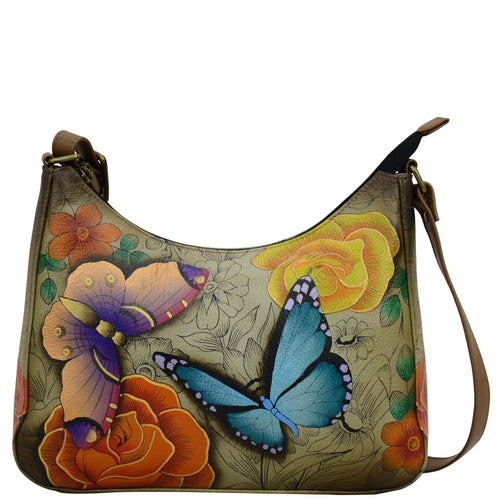 Anna by Anuschka style 8362, handpainted Large Hobo. Floral Paradise Tan painting in tan color. Featuring top zip entry to main compartment and inside zippered wall pocket, open wall pocket two multipurpose pockets.