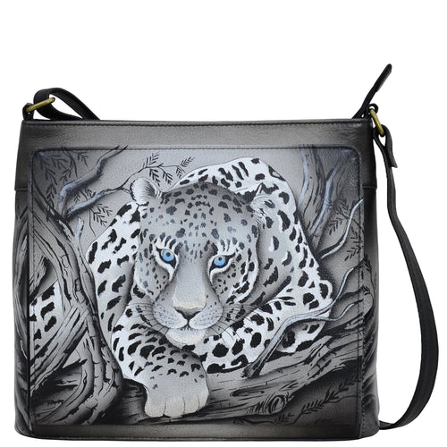 Anna by Anuschka style 8371, handpainted Organizer Crossbody. African Leopard painting in black color. Featuring one zippered partition pocket, sixteen credit card slots, one slip in multipurpose pocket.