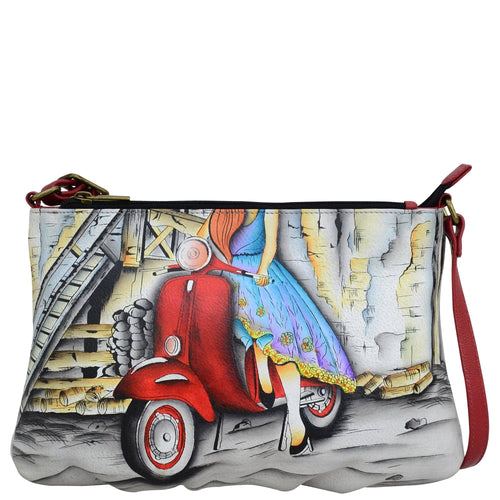 Anna by Anuschka style 8373, handpainted Wide Crossbody. Roman Dreams painting in white color. Featuring Two top zip compartments and inside one zippered wall pocket, two multipurpose pockets.