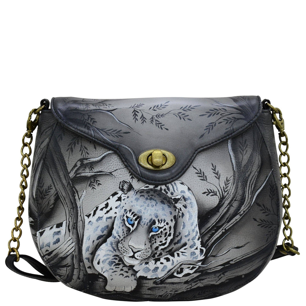 Anna by Anuschka style 8391, handpainted Sling Flap Bag. African Leopard painting in black color. Featuring inside one zippered wall pocket, two multipurpose pockets and one full length slip in pocket under flap.