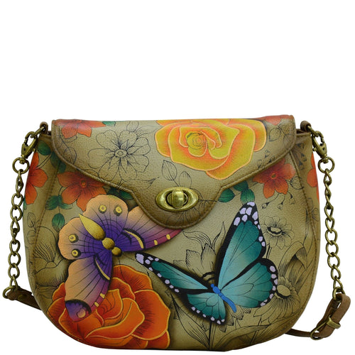 Anna by Anuschka style 8391, handpainted Sling Flap Bag. Floral Paradise Tan painting in tan color. Featuring inside one zippered wall pocket, two multipurpose pockets and one full length slip in pocket under flap.