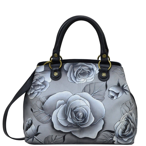 Anna by Anuschka style 8392, handpainted Multi Compartment Satchel. Romantic Rose Black painting in Black color. Featuring two compartments with magnetic snap button, inside one full length zippered compartment and full length zippered wall pocket, two multipurpose pockets with gusset.