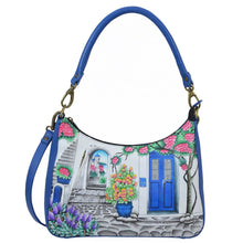 Load image into Gallery viewer, Anna by Anuschka style 8487, handpainted Large Top Zip Hobo. Magical Greece in Blue color. Featuring inside one zippered wall pocket, one open wall pocket, two multipurpose pockets with gusset and front vertical zippered pocket.
